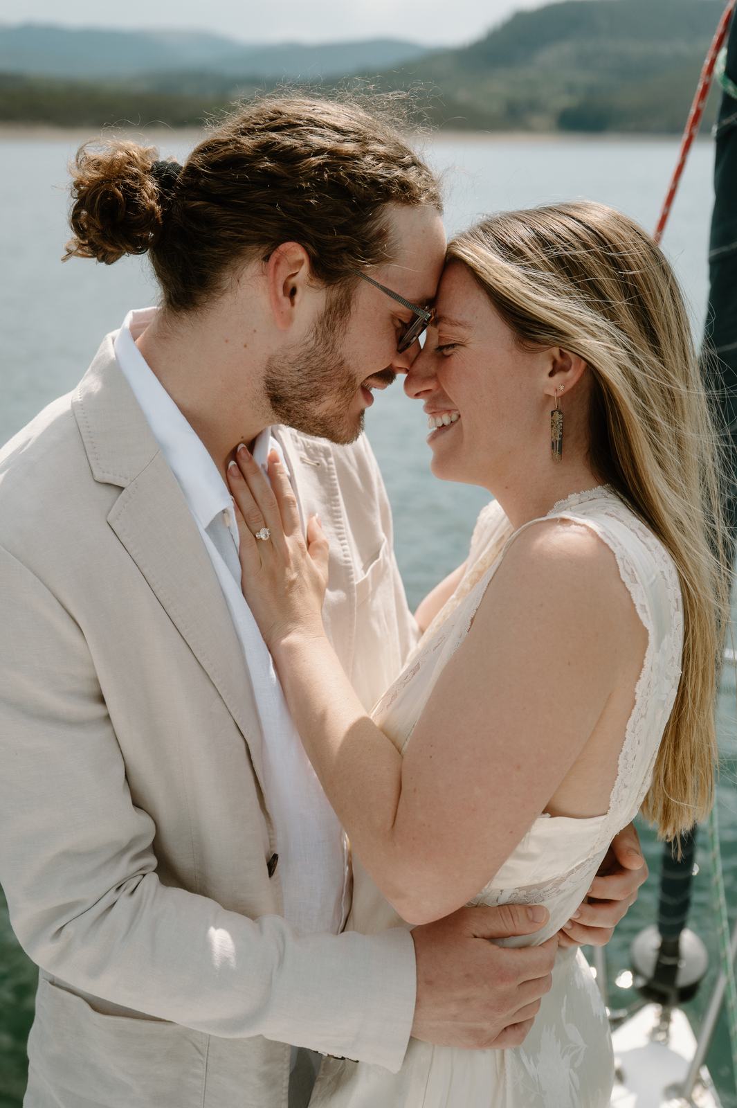Lauren and Christopher forehead to forehead on the deck